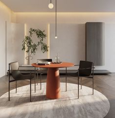 a round table with two chairs and a potted plant in the middle is shown