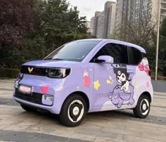 a purple car with cartoon characters painted on it