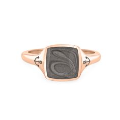 Close By Me's Anchor Signet Cremation Ring in 14K Rose Gold floats in the center of a solid white background, facing front. The square-shaped cremation setting is dark grey in color and has a bold, visible swirl. The anchor imprints in the band, on either side of the setting, are clearly visible. Pet Cremation Jewelry, Chevron Jewelry, Rose Gold Square, Cremation Ring, Stormy Seas, Chevron Earrings, Chevron Bracelet, Urn Jewelry, Anchor Necklace