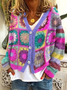 a woman wearing a colorful crochet cardigan sweater