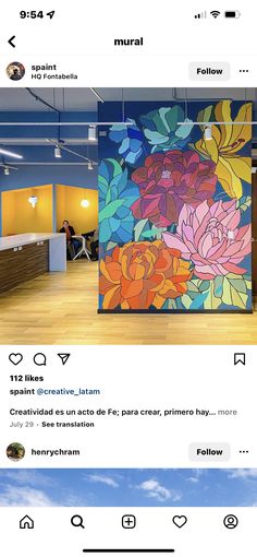 an instagram page with flowers painted on the wall