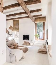 a living room filled with furniture and a fire place