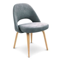 an upholstered chair with wooden legs and a grey velvet seat pad on the back