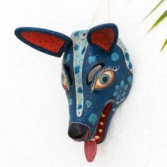 an animal mask hanging on the wall