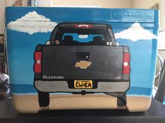 the back end of a painted chevrolet truck