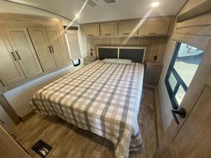 a bedroom with a bed and cabinets in it