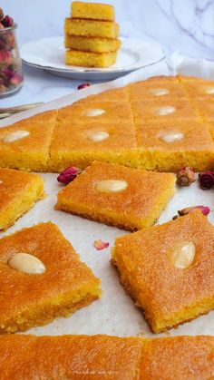 several pieces of cake sitting on top of a table