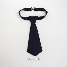 Fancy necktie made of silk. The detachable women's skinny tie. Handmade item Materials: 100% black silk Adjustable length: Yes Width: 7 cm / 2.7 inches Length: 23, 25.5, 28 cm / 9, 10, 11 inches Weight: 20 g Description The tie is handcrafted of 100% silk. The tie is attached to the strap and it regulates the girth of the neck. Our unique accessories will upgrade business casual and hipster clothes and will flatter office and formal wear. It is made from the ground up. Packed with box. It can be Black Standard Tie For Office, Black Standard Tie With Bow, Black Tie For Black Tie Events, Black Ties Neckwear For Black-tie Events, Classic Black Neckwear For Gift, Black Neckwear With Ties For Black-tie Events, Adjustable Bow Tie For Business, Classic Black Neckwear As A Gift, Classic Black Neckwear Gift