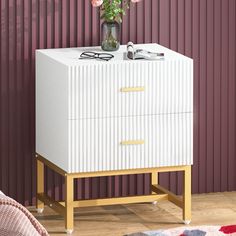 PRICES MAY VARY. 🌟2 Streaked Drawer: Wooden countertop is for displaying lamps, clocks, books, eyeglasses, and more — With a striped texture and golden handle, the modern white nightstand can be pulled out easily for concealing clutter, accessories, gadgets, etc 🌟Good Dream Tonight: The lamp on the white and gold nightstand is on, your favorite novels lying on the open shelf, and your cozy pajamas and eye masks in the drawers; with everything under your control, this nightstand is a great piece in any home's decor, complementing most furnitures whether traditional, rustic, or modern. 🌟White Nightstand, Shining Everywhere: More than a nightstands bedroom but a bedside storage night stand, 2 drawer white gold nightstand, sofa end tables, office supply storage, kids nightstand for bedroom, White And Gold Nightstand, Nightstands Bedroom, Gold Nightstand, Nightstand Modern, Metal Nightstand, Bed Side Table, Modern End Tables, White Nightstand, Night Stands