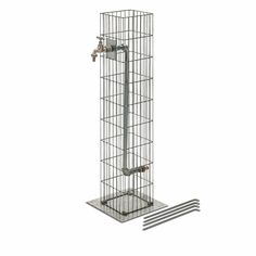 a bird cage with two birds in it on top of a metal pole and one is attached to the wall