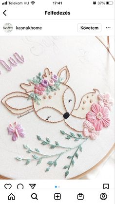 the embroidery pattern on this hoop is very cute and it looks like an animal with flowers in its mouth