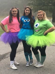 three girls dressed up as monsters posing for the camera