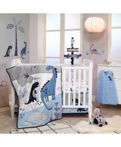 a baby's room decorated in blue and white with animals on the wall, crib bedding, and dresser