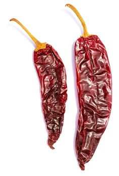 two red peppers on a white background with no one around them or in the photo