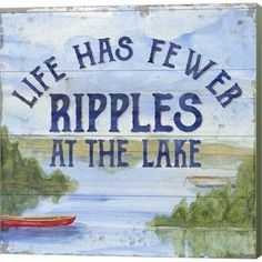 a sign that reads, life has few ripples at the lake with a boat on it