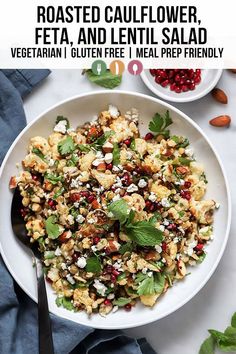 a white bowl filled with vegetables and feta cheese on top of a blue napkin