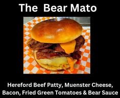 the bear mato has been served with bacon, fried green tomatoes and cheese