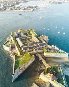 an aerial view of a fort on the water