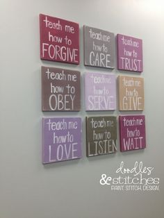 six canvases with different sayings on the wall