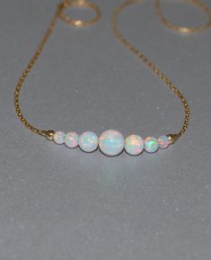 Opal Necklace Tiny Dot Necklace Small Opal by ModernJewelBoutique Gold And Opal Jewelry, White Opal Necklace With Delicate Chain, White Opal Round Bead Necklaces, White Opal Bead Necklaces, White Opal Round Beads Necklace, Opal Aesthetic, Iridescent Jewelry, Horizontal Bar Necklace, Blue Opal Necklace