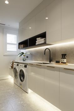 an appliance is displayed on the screen above a washer and dryer