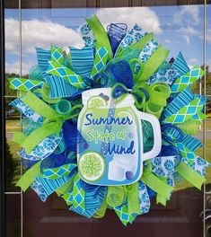 a blue and green wreath with the words summer state of mind