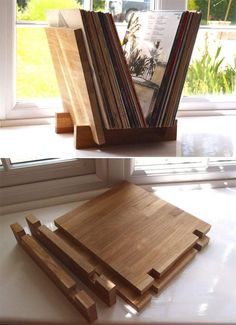 there are three wooden bookshelves on the window sill, and one is made out of wood