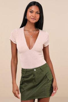 Get ready to look casual yet charming all summer long with a cute laidback look like the Lulus Stylish Appeal Cream Textured Short Sleeve Top! Textured ribbed knit shapes this flirty top with short sleeves that frame a plunging V-neckline and an empire-style waist atop a fitted silhouette that is sure to hug your figure perfectly. This anything-but-basic top is ready to be styled with any of your favorite weekday 'fits this season! Fit: This garment fits true to size. Length: Size medium measure Fitted V-neck Knit Top For Day Out, Chic Short Sleeve Bodysuit For Summer Night Out, Summer V-neck Knit Top For Day Out, Trendy V-neck Short Sleeve Top For Day Out, Fitted Short Sleeve Bodysuit For Spring, Spring Ribbed V-neck Knit Top, Fitted Casual Short Sleeve Bodysuit For Summer, Casual V-neck Short Sleeve Bodysuit For Summer, Casual Fitted Short Sleeve Bodysuit For Summer