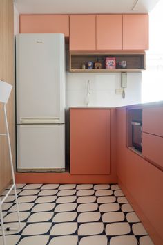 a white refrigerator freezer sitting inside of a kitchen