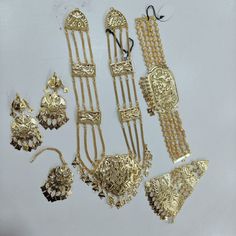 This is Handmade  Punjabi Handmade One Gram Gold Choker Necklace Ranihaar Set With Hair Jewelery / Punjabi Full Bridal Jewelery / Lavvan Jewelery / Pearl Gold Choker Set With Earings And Mangtikka For Women And Girls/ Jadau Jewelery / Jadau Earings / Punjabi Wedding Set / Indian Wedding Set / Jaggo Set / Traditional Morni Earings / Sangeet Jewelery Thank You :) Kundan Sets For Eid And Traditional Ceremonies, Gold Traditional Wear For Wedding And Navratri, Eid Festival Gold Sets With Motifs, Ceremonial Dupatta With Dabka For Festivals, Traditional Gold Tikka, Ceremonial Navratri Dupatta With Dabka, Bollywood Style Bridal Sets With Tilla, Traditional Gold Sets With Zari Work, Gold Ceremonial Set With Cutdana