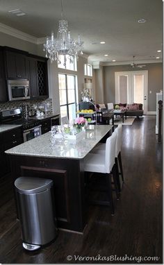 a large kitchen with an island in the middle