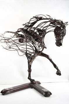 a sculpture of a horse is shown on a white background with no people around it