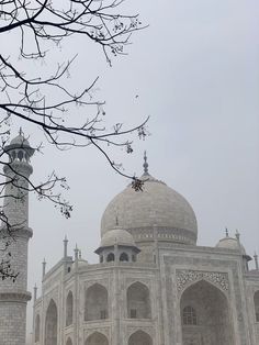 a large white building with two towers on top