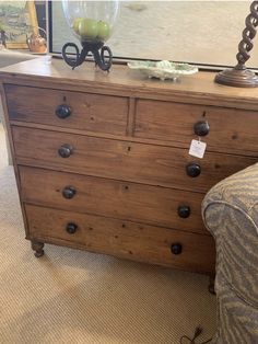 an old dresser with some knobs on it