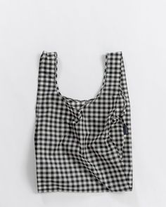 a black and white checkered bag on a white background