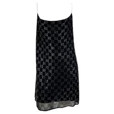 Presenting the rhinestone 'GG' Gucci slip dress of your dreams, designed by Tom Ford. From the Spring/Summer 1998 collection, this incredibly rare dress is constructed of two layers: an interior black slip and an exterior sheer layer covered in rhinestones in Gucci's famous 'GG' monogram pattern. The dress features a wide scoop neckline and spaghetti straps. Rihanna recently wore a similar Gucci by Tom Ford dress to the Gucci after-show party in February of 2022. The cropped shirt version of thi Black Gucci Dress, Gucci Dress Gowns, Vintage Gucci Dress, Gucci Black Dress, Gucci Outfits Women, Haut Transparent, Tom Ford Dress, Gucci By Tom Ford, Gucci Clothes