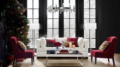 a living room filled with furniture and a christmas tree