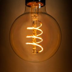 a light bulb that is turned on and has some lights in it with wires coming out of it