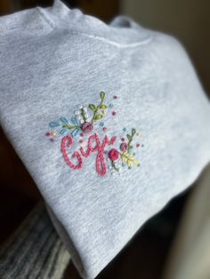 an embroidered t - shirt with the word girls on it