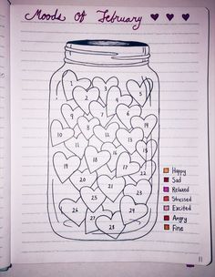 a jar filled with hearts sitting on top of a notebook