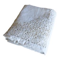 an image of a white bed sheet with crochet on the bottom and sides