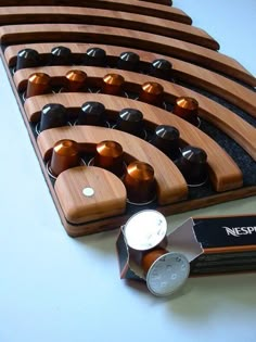 a wooden abacusk with several different types of beads