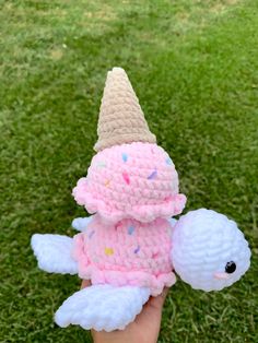 a crocheted stuffed animal with an ice cream cone on it's head