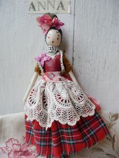 a doll is hanging on the wall