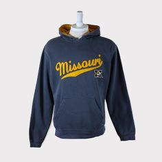 Embroidered Vintage 90s Missouri Tigers (University of Missouri) Football/Baseball/Basketball/Hockey NCAA Hoodie 💯 SATISFACTION AND AUTHENTICITY ⭐ MEASUREMENTS (when laid flat) Size on Tag: M Length: 69cm or 27 inches Armpit to armpit: 57cm or 22.5 inches ⭐ CONDITION 9/10 (Very good) Details: No holes Material: Cotton Color: Gray Brand: J America 🔷 Please give us your phone no. together with address after you purchased. 🔷Please keep in mind that our items are vintage so they may show some sig Missouri University, Tiger Hoodie, Football Sweater, University Shirt, Tiger Shirt, Missouri Tigers, University Of Missouri, Tiger T Shirt, Spirit Wear