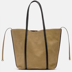 Zara Suede Tote Bag In Taupe Brown Brand New With Tags. Msrp $149.00. No Low Offers Please. Suede Tote Bag. Side Tie Detail. Lined Interior. Shoulder Straps. Magnetic Closure. Approximate Height X Length X Width: 17.2 X 14 X 4.3 Inches (43.8 X 35.5 X 11 Cm) Outer Shell Main Material 100% Cow Leather Additional Material 100% Polyurethane Lining 100% Polyester Taupe Brown | 6059/110 New Posher? Sign Up With Invite Code 0ld_fashioned For $10 Off Your First Poshmark Purchase My Photos Are Taken Insi Light Brown Hobo Bag For Shopping, Khaki Shoulder Bag For Shopping, Khaki Tote Bucket Bag For Shopping, Chic Khaki Bag With Double Handle, Chic Khaki Rectangular Bucket Bag, Chic Suede Tote Bag, Chic Rectangular Khaki Bucket Bag, Chic Khaki Bag With Adjustable Strap, Chic Suede Hobo Bag For Shopping