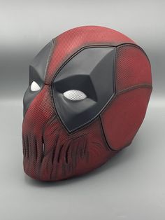 A 3D printed mask of Deadpool, with fabric texture in a horror version. This mask is printed with PLA and is sold including magnets. The mask can be bought as a DIY kit, already painted or including weathering. If you want a color other than red, that is also possible, just send me a message. Magnets are only included in the painted version and beyond. If you wish, the size of the mask can be adjusted to fit your head. Please write me your head circumference in cm. In addition to the angry eyes 3d Printed Mask, Deadpool Mask, Mask For Halloween, Angry Eyes, Custom Mask, Deadpool 3, Cosplay Mask, Mask Template, Costume Mask