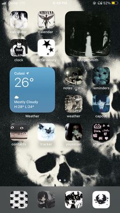 an iphone screen with skulls and other stickers on it