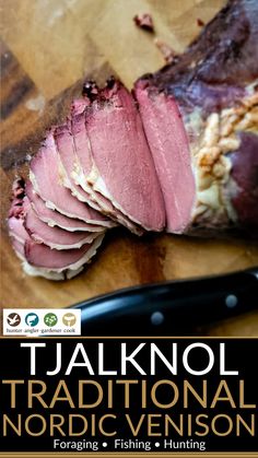 a close up of sliced meat on a cutting board