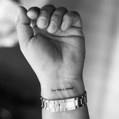 a woman's wrist tattoo with the words you have nothing to do on it